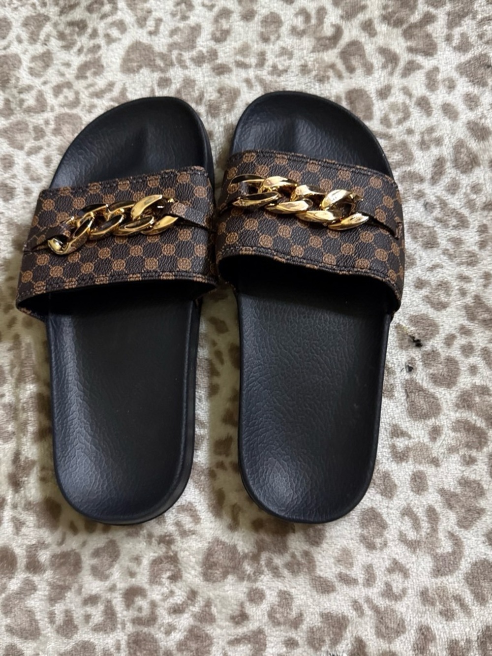 Women's Black Slide Sandals with Brown Pattern and Gold Chain Accent
